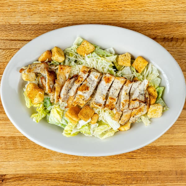 Tuscany Italian Restaurant's Caesar salad with grilled chicken, croutons, and parmesan cheese.